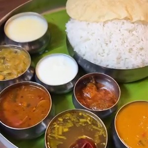 (White Rice, Sambar, Kara Kuzhambu, Rasam, Koottu, Poriyal, Curd, Pickle, Payasam & Pappad)